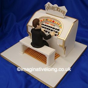 Man playing Wurlitzer Birthday Cake