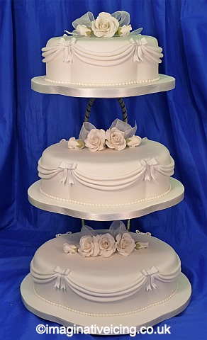 Traditional 4 tier ivory wedding cake with sugar roses & ivy