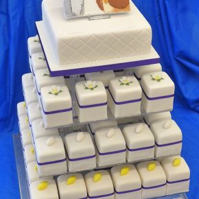 Lady & the Tramp Square Wedding Cake with tiers of mini cakes